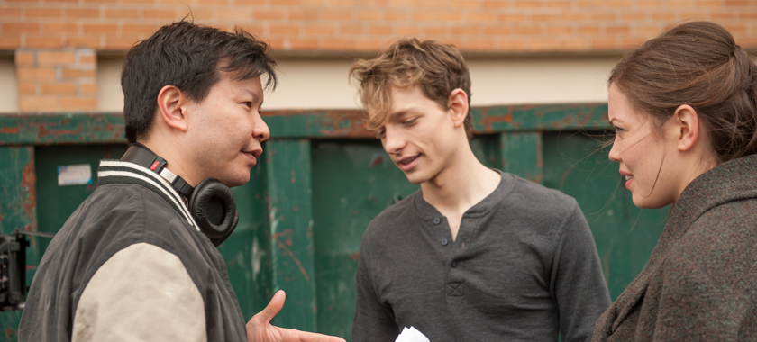 Director Patrick Wang with actors Mike Faist and Sonya Harum on the set of "The Grief of Others."