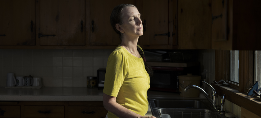 Sue, 59, basks in the sunlight in her old kitchen in Connecticut shortly before moving into her mother's house, marking the official end of her second marriage.