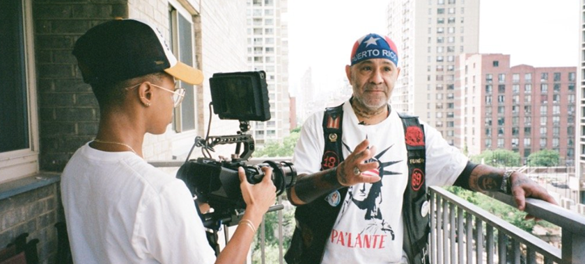 Director of Photography Morgan Powell films main character Chino Familia on an Upper West Side balcony. He's wearing a Puerto Rican flag head cap and clothes symbolizing the island's independence movement.