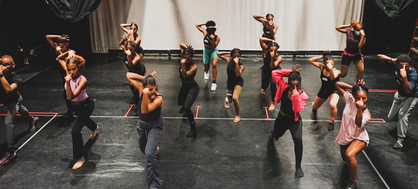 A group of dancers from The Black Artists Dance Collective in a performance space