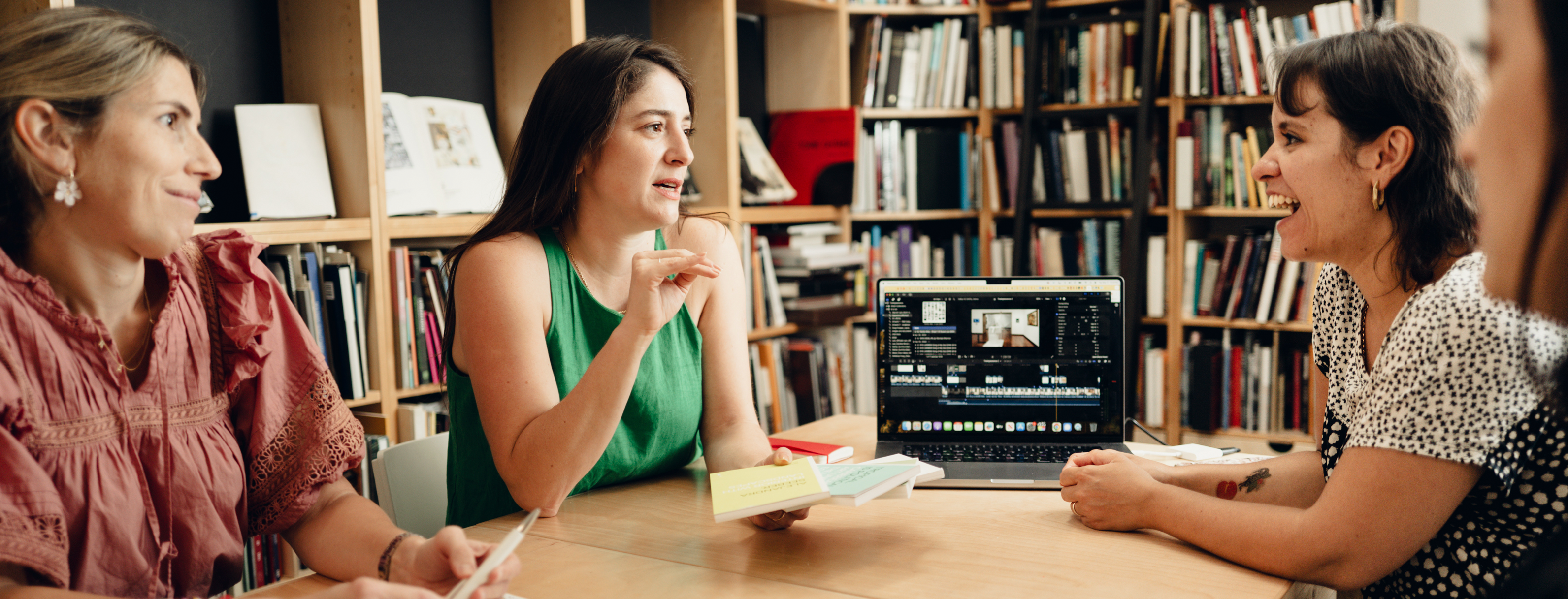 2025 Vilcek Foundation Prize Recipient Aime Iglesias Luki in conversation with three other individuals in a library-like setting